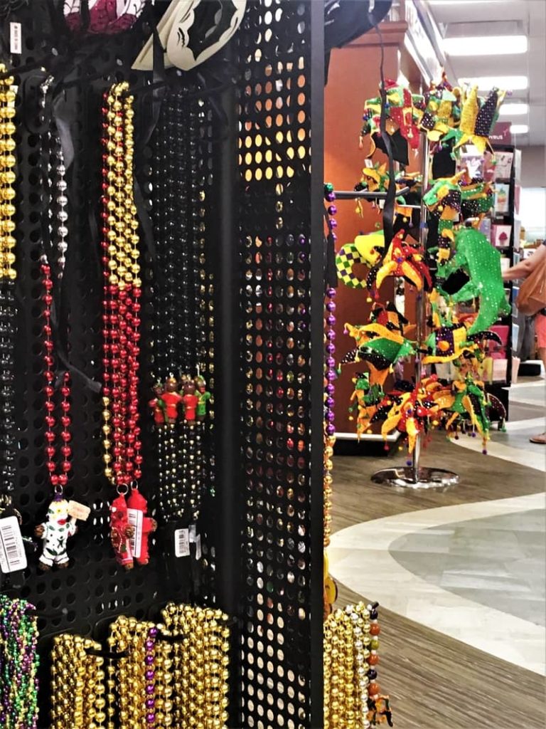 Mardi Gras beads and trinkets at New Orleans airport. OurTravelCafe.com