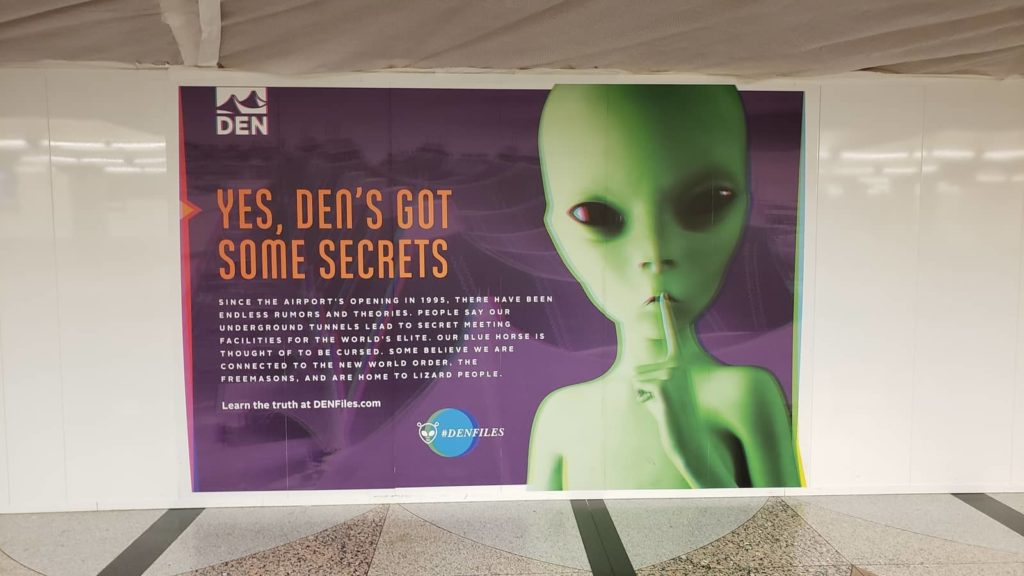Alien conspiracies are part of the DIA Airport signage, OurTravelCafe.com