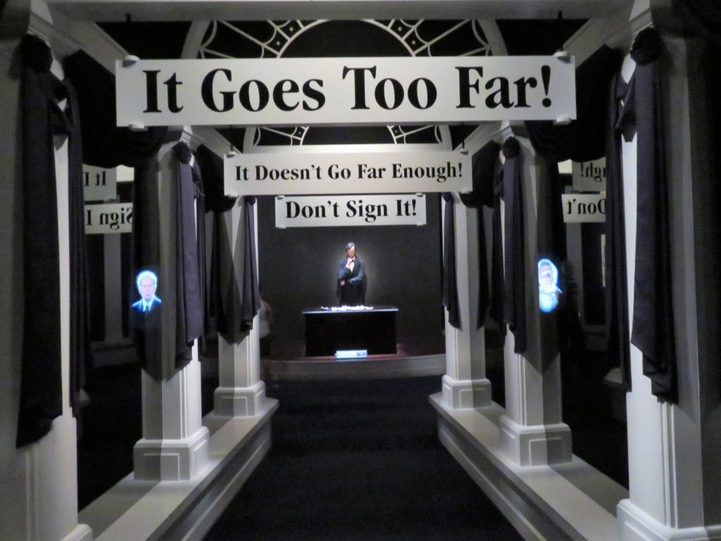 Shouting headlines and figures lead to a lonely Lincoln considering the Emancipation Proclamation.