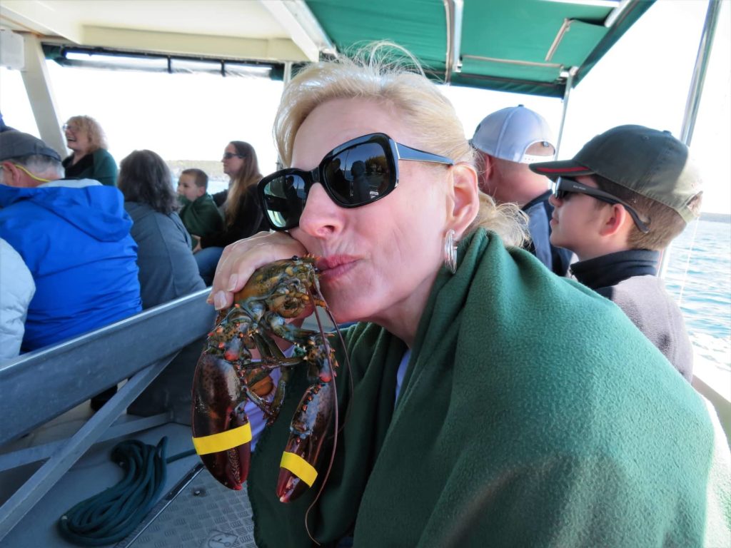 Lobster kissing on Lulu Lobster Boat Tour. OurTravelCafe.com