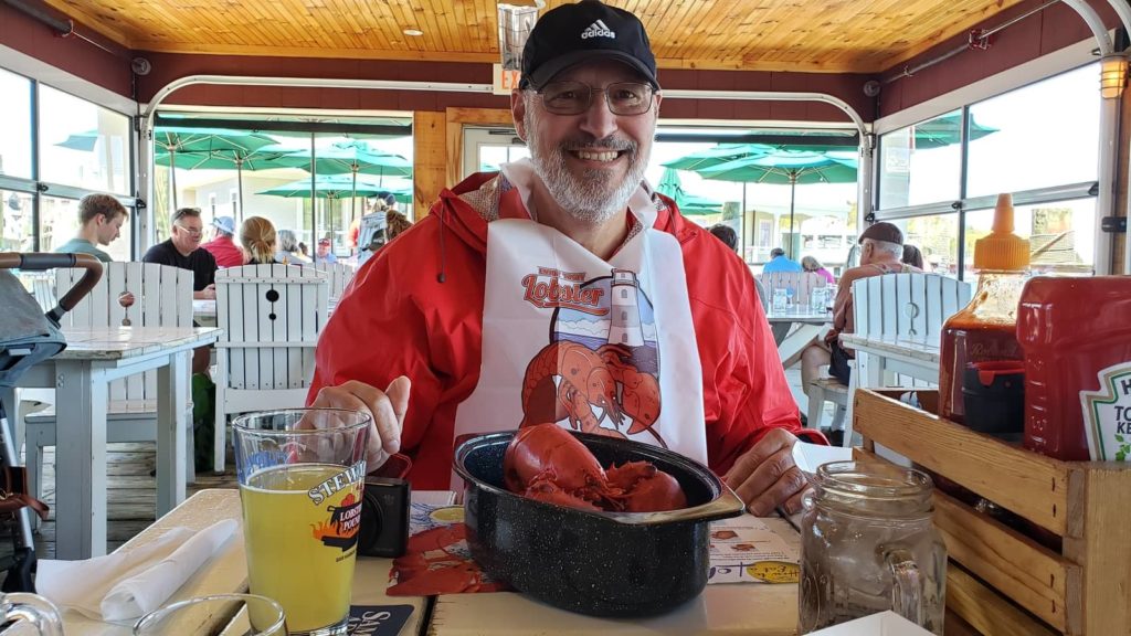 Lobster eating at Stewman's, dockside in Bar Harbor. OurTravelCafe.com