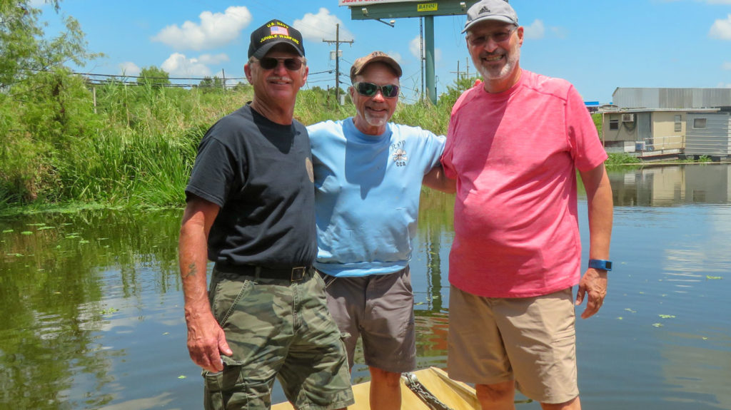 Air boat captain Craig Matherne poses with locals after swamp tour. OurTravelCafe.com