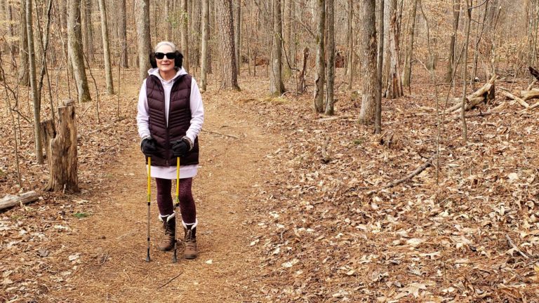 Woman in colorful clothes hiking in winter near Atlanta
