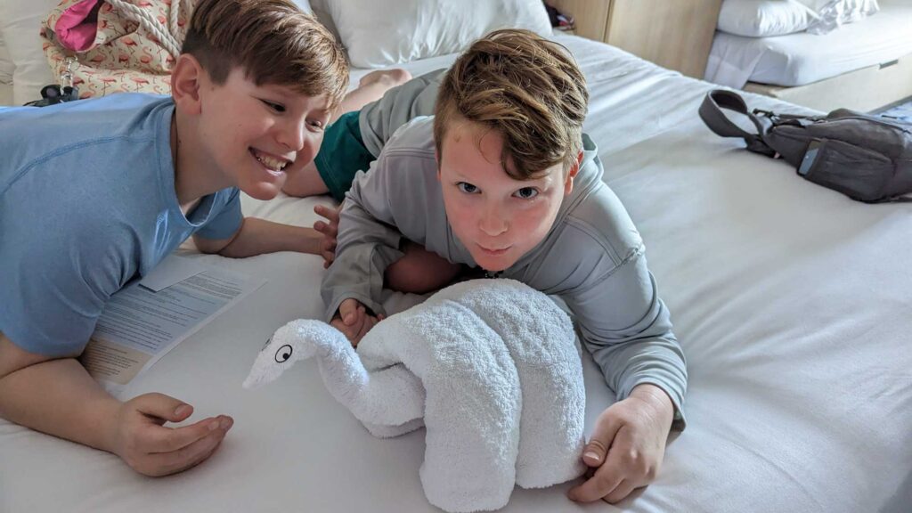 Boys with towel animal on cruise ship